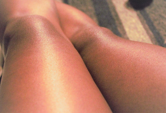 KSR Natural Body Oil on legs in the sun